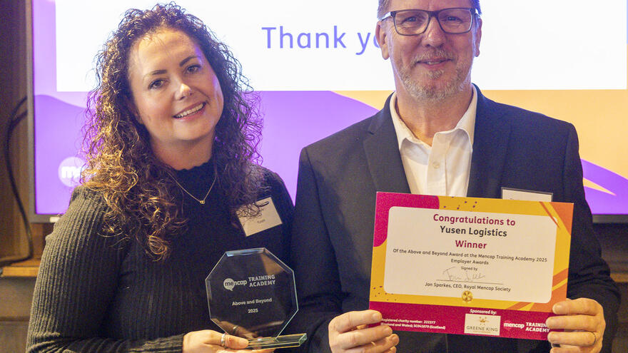 Steve Cletheroe and Clair Royle from Yusen Logistics with their Above and Beyond Award at the 2025 Mencap Training Academy Employer Awards.