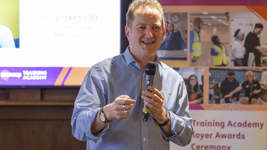 Mencap Chief Executive, Jon Sparkes presenting at the 2025 MTA Employer Awards.